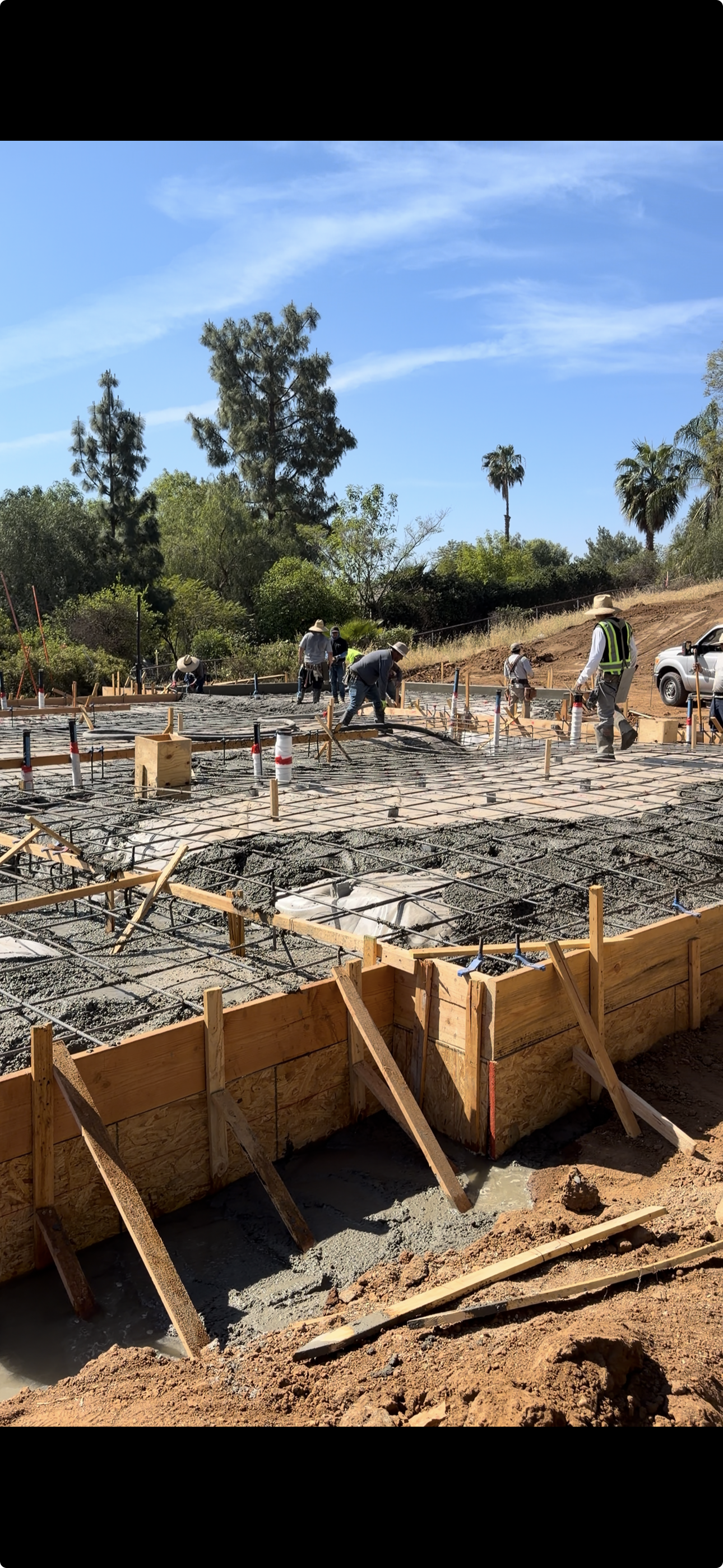Concrete foundation pour with rebar grid on construction site